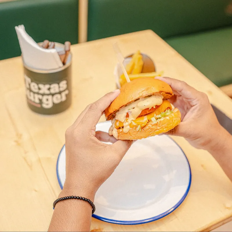 Texas Burger in hand