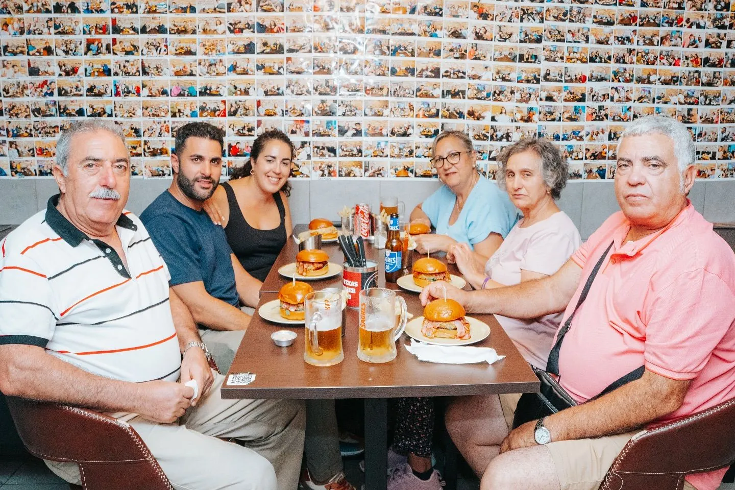 Guests in front of the Texas Burger photo wall